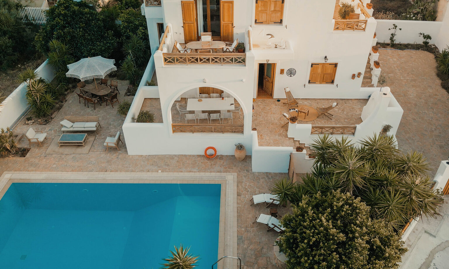 Aerial view of Villa Kyma pool and terraces in Aegina